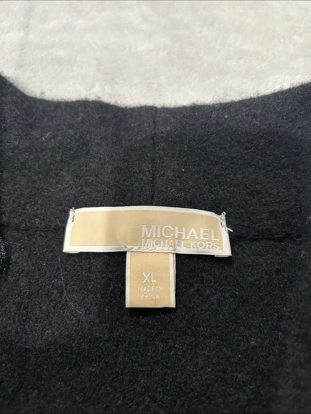 Michael Kors black wool V-Neck Sweater with Gold Buckle Accents